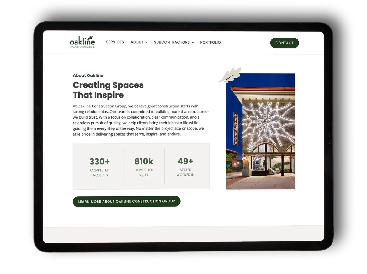 Tablet showing the Oakline Construction webpage. Features text on creating inspiring spaces and a lit-up building facade image. Includes project stats and a "Learn More" button.