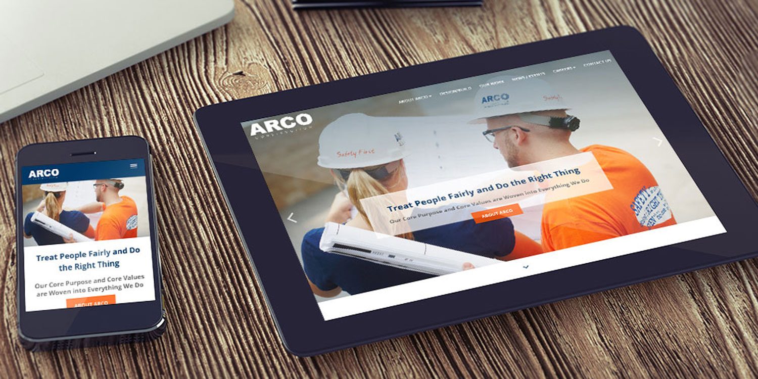 arco-mockup-on-tablet-and-mobile tablet and phone showing home screen of arco website